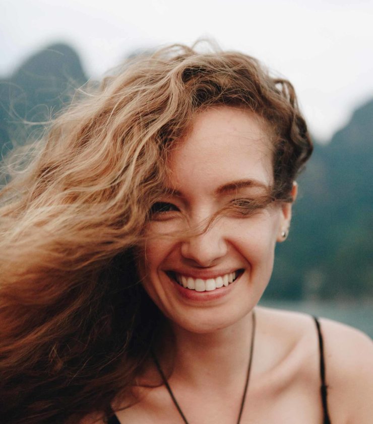 portrait-of-a-beautiful-woman-with-curly-hair-P6NUL3Y-scaled.jpg